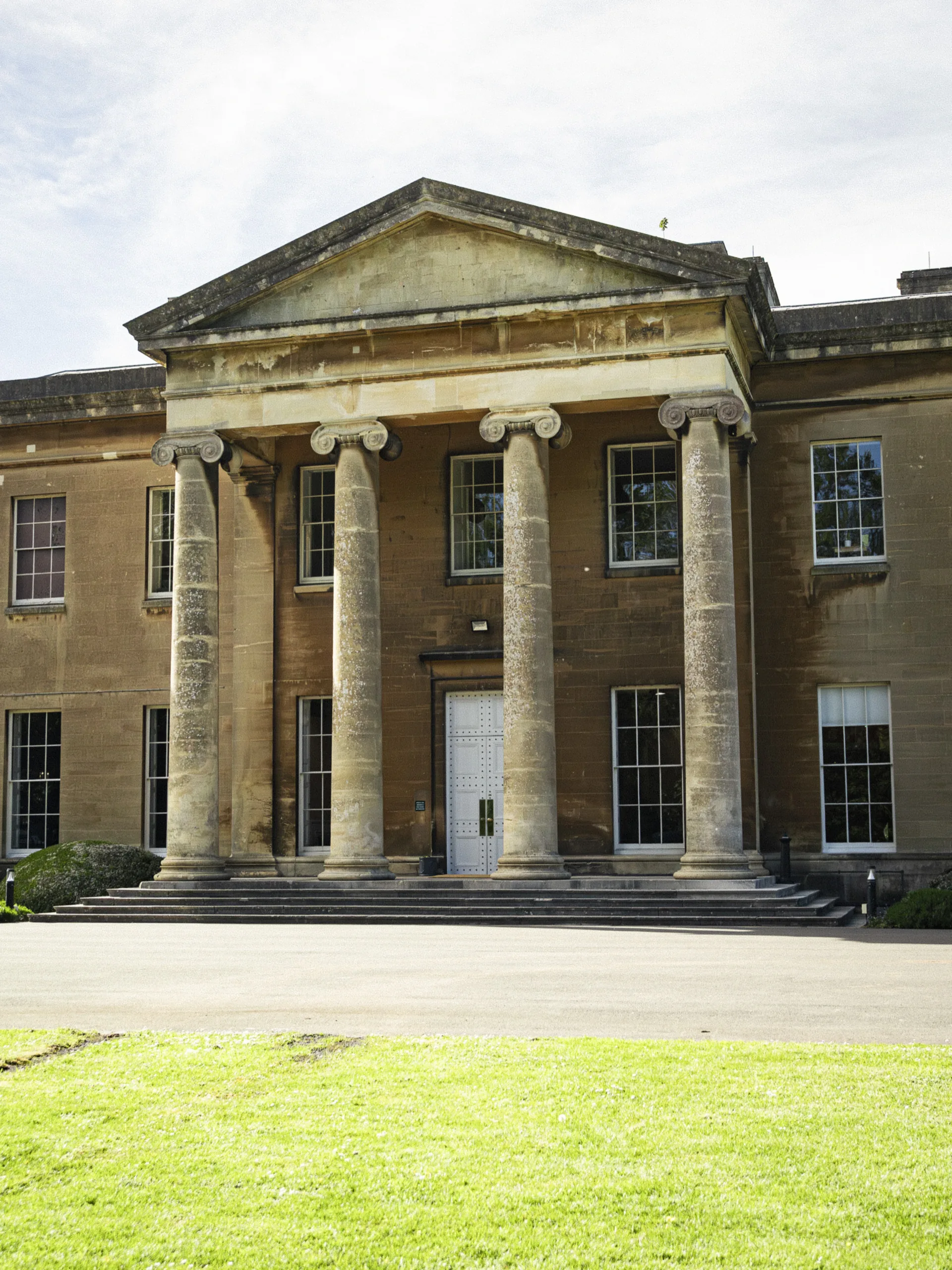 Utility-style head-on view of the mansion.